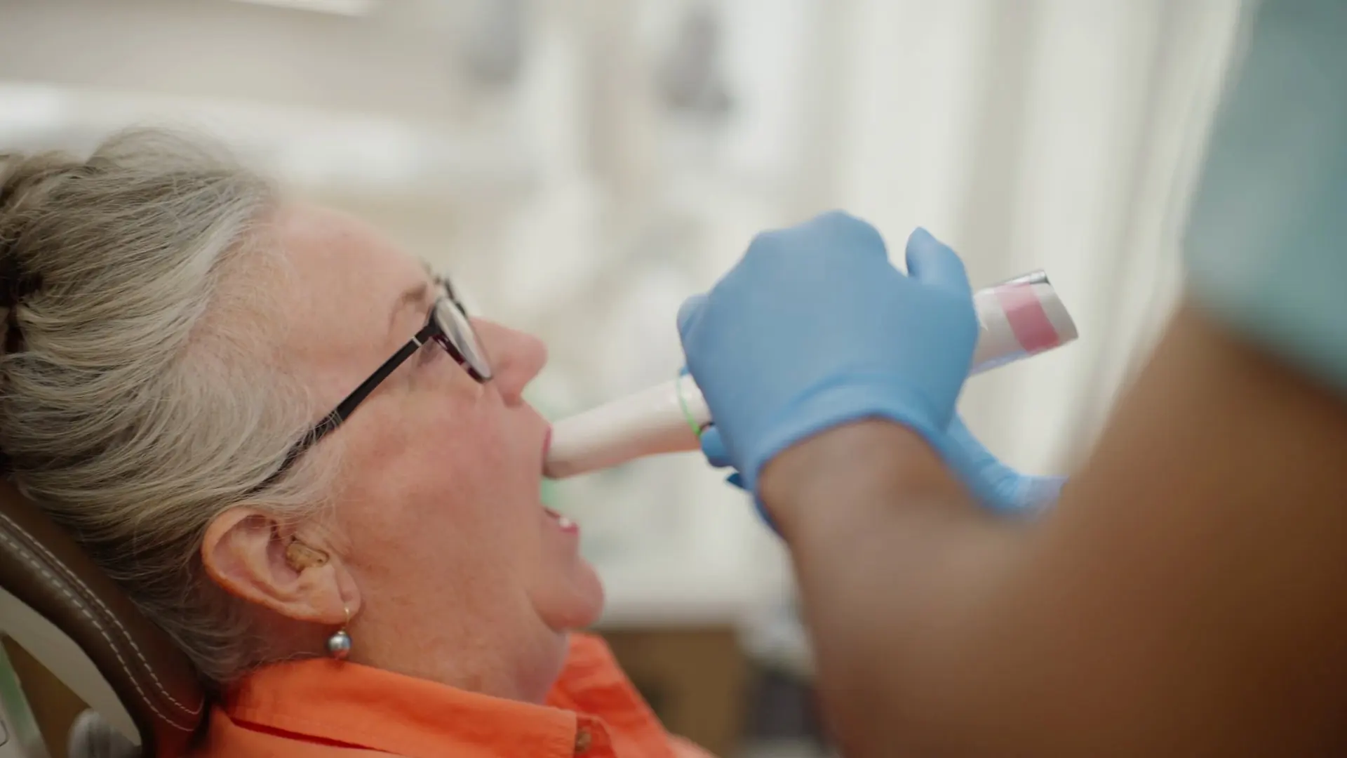 A patient having an intraoral scan of their teeth